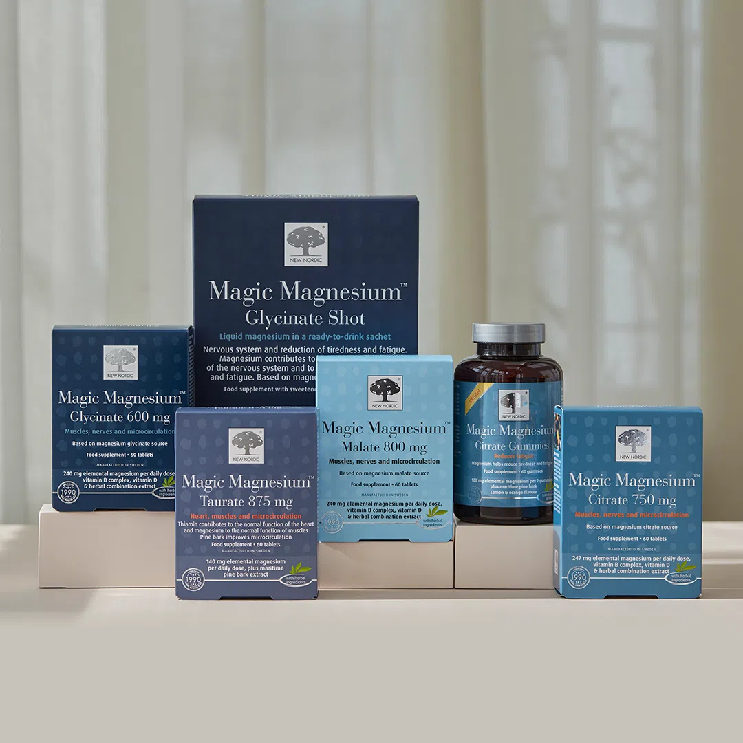 Range of Magic Magnesium™ products displayed in blue packaging on a neutral background.