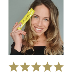Collagen Shot™ 14 Woman smiling and posing with a collagen shot™ with five stars displayed underneath.
