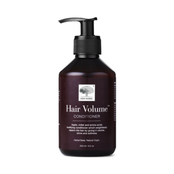 New Nordic Hair Volume⢠Conditioner repairs and nourishes hair with apple, millet, and rice protein, adding volume, shine, and softness. Image of product.