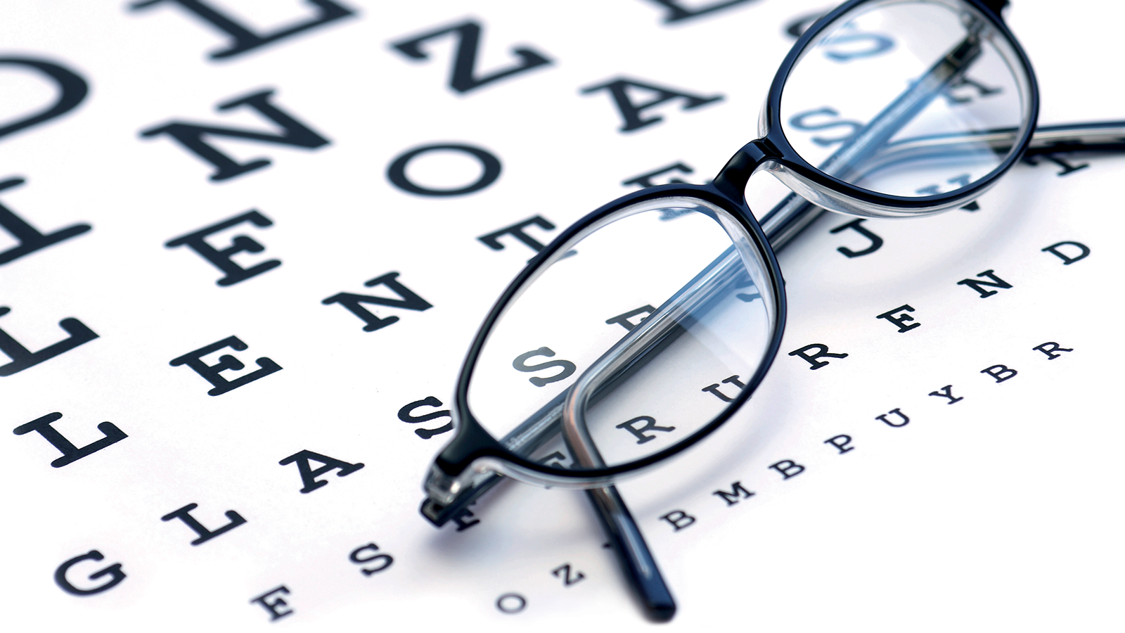 Blue Berry™ Eyebright 20 Eyeglasses on eye chart background.